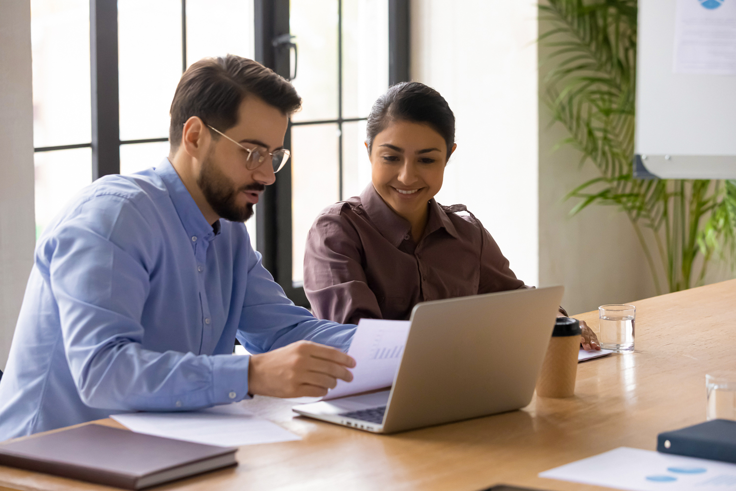 Businessman mentor teaching Indian woman